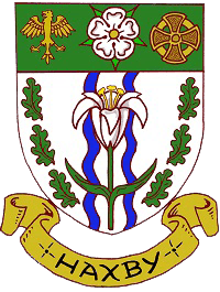 The arms of Haxby Town Council: a shield bearing a lily over blue wavy bars between oak sprigs, beneath an eagle, a white rose and a gold cross, above a banner reading Haxby.