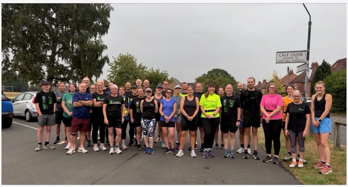 Around thirty-five Haxby Runners of all ages gathered at Calf Close, by the sign for Lady Kell Gardens, before a group run.
